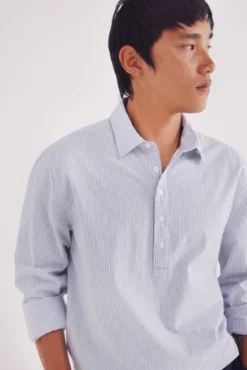 Camisa polo riscas