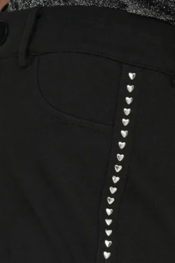 Legging com tachas laterais